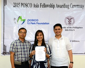 Athena Charanne R. Presto, a BA Sociology student and a new recipient of the POSCO scholarship, is flanked by Vice Chancellor for Student Affairs Neil Martial R. Santillan and POSCO PMPC, Inc. President Shin-Je Cho during the POSCO Asia Fellowship Awarding Ceremony on Mar. 31.